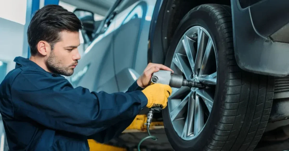 a man doing tire rotation