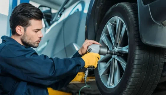 a man doing tire rotation